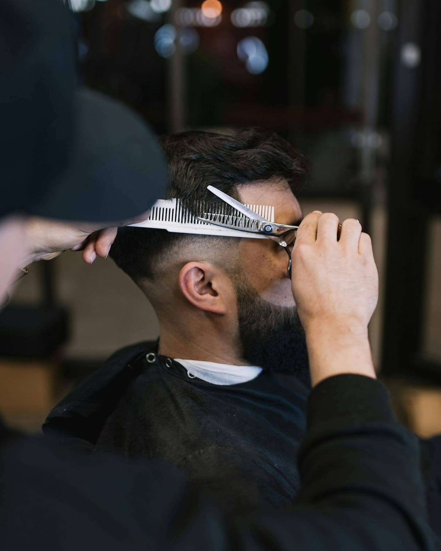 Scissor-over-comb work on a classic cut